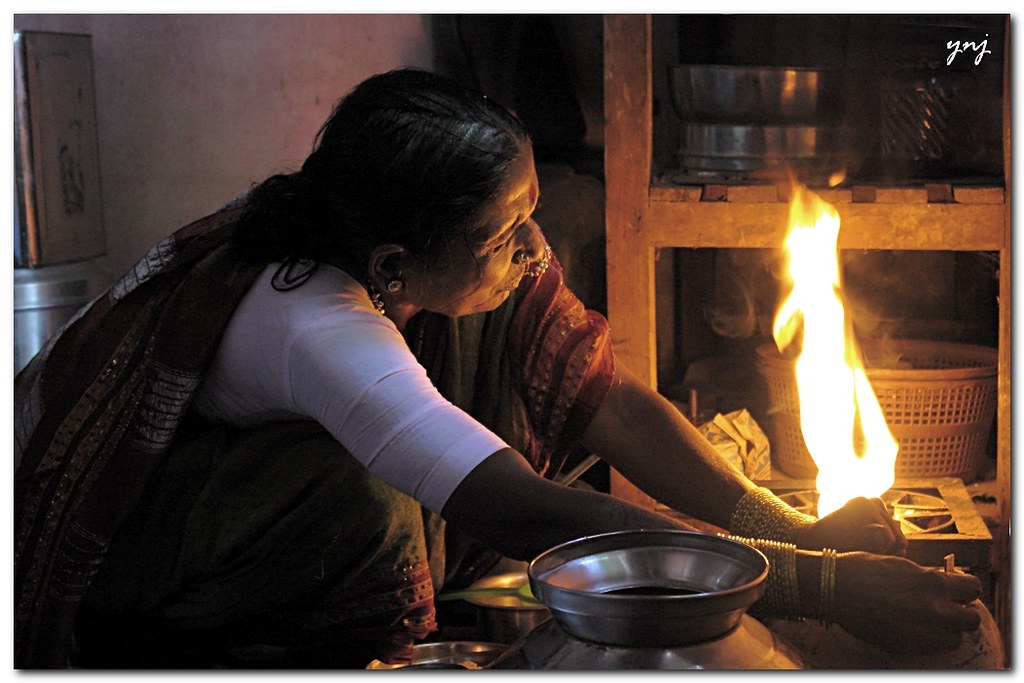 Cooking or Fire? (environmental portrait)